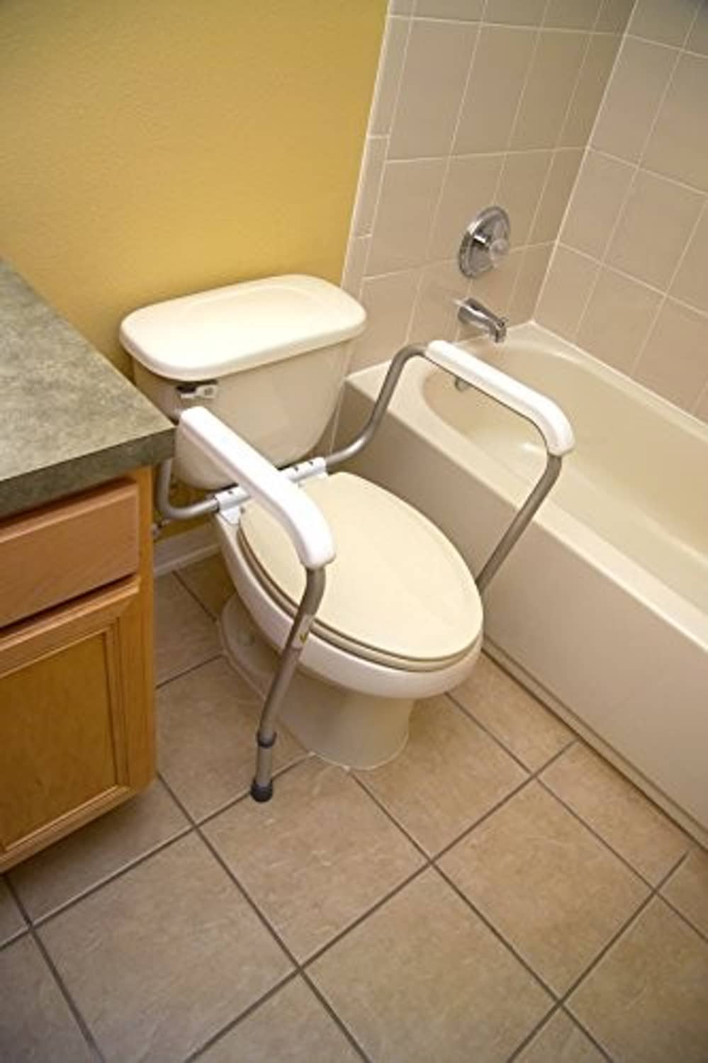 Toilet safety rails with curved arm supports and adjustable feet, white frame