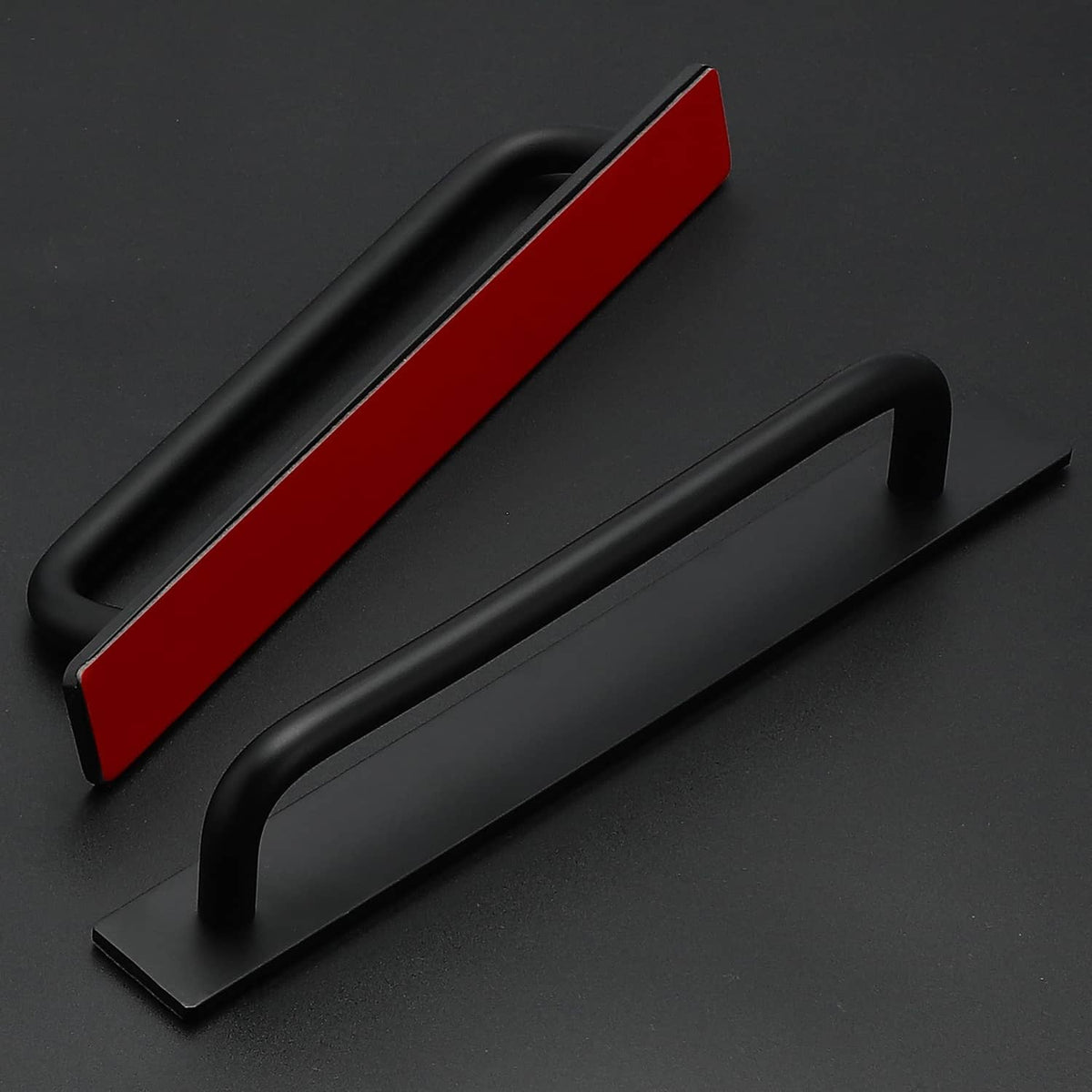 Set of black cabinet handles with curved bars and flat mounting bases
