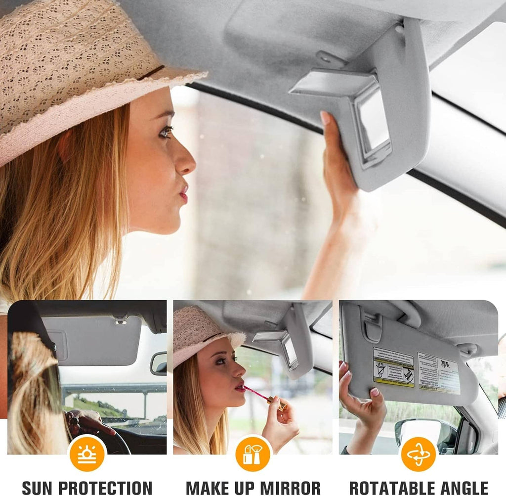 Gray sun visor with mirror panel in car headliner near the driver side