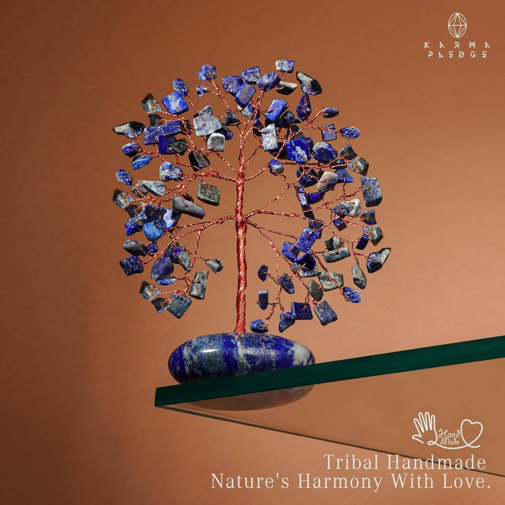 Lapis lazuli crystal tree centerpiece with blue chips on oval base palm stone