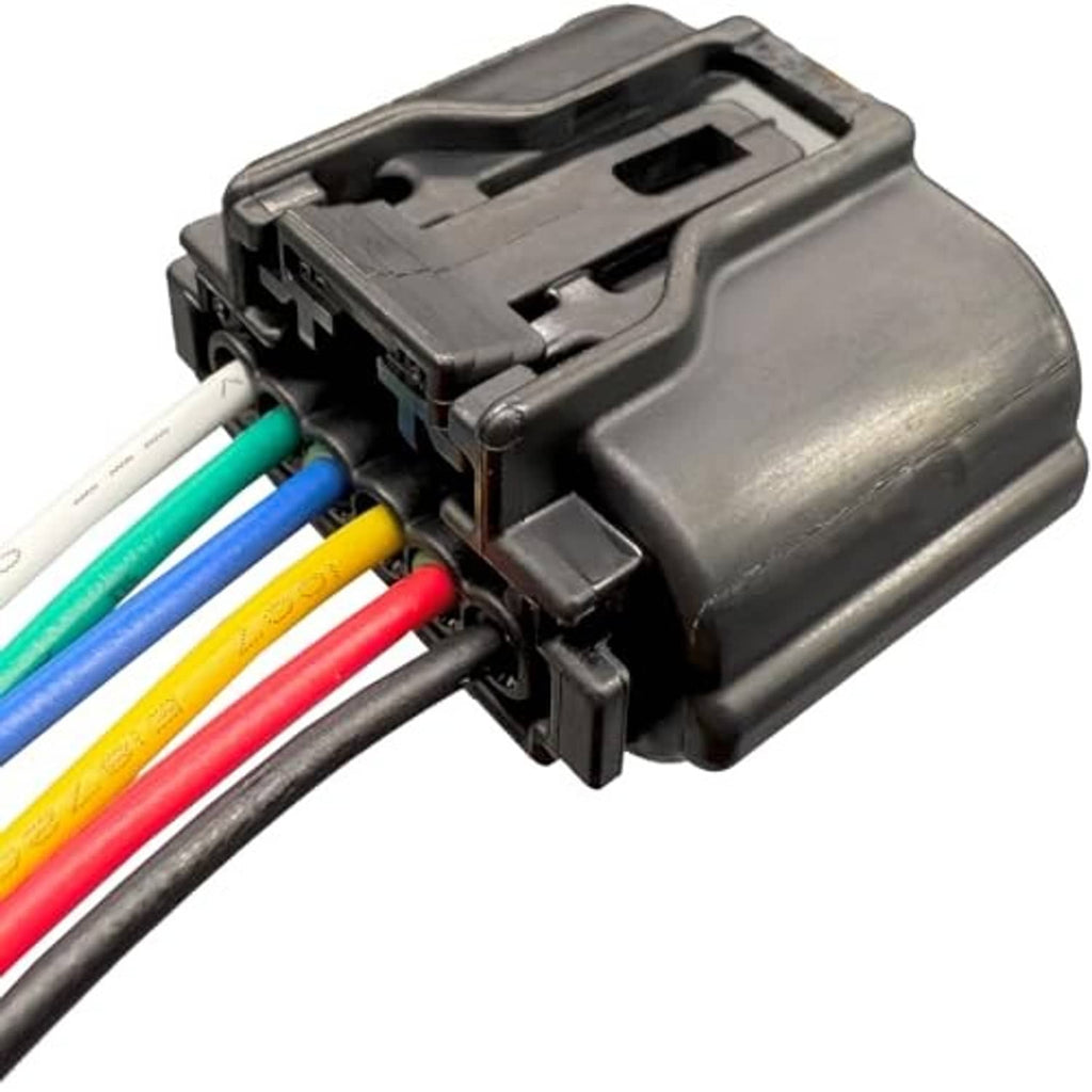 Close-up of black electrical connector with colored wire leads and locking housing