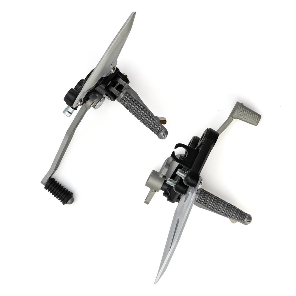 Side view of motorcycle foot peg brackets with silver plates and textured metal foot pads