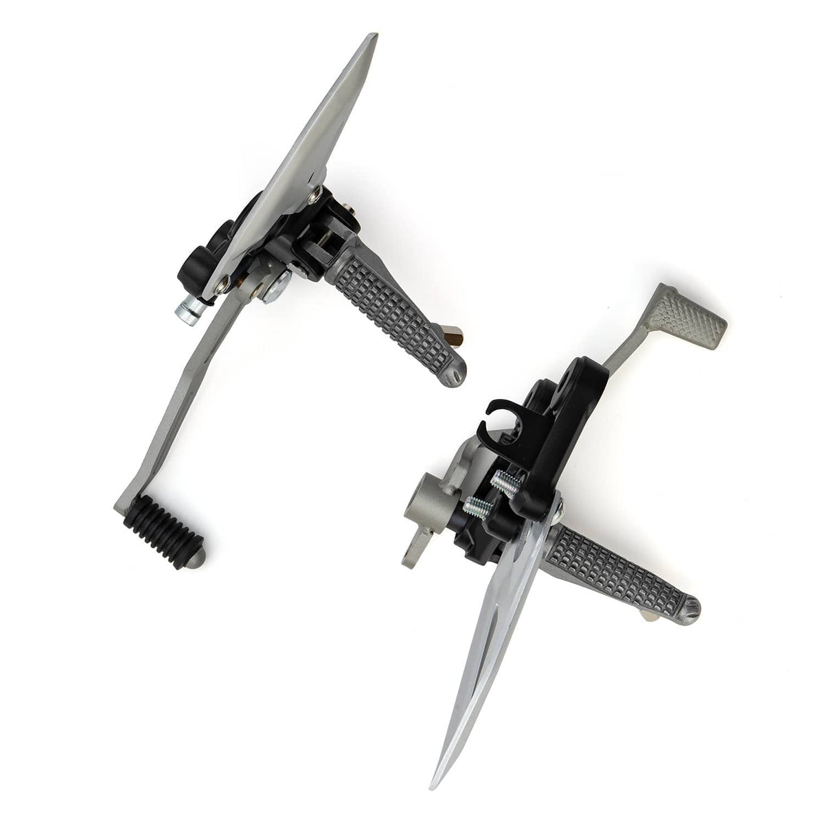 Side view of motorcycle foot peg brackets with silver plates and textured metal foot pads