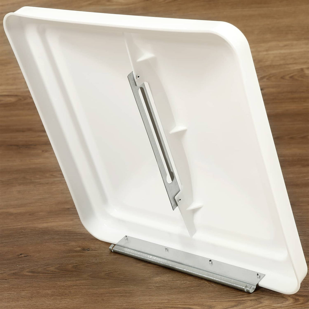 White RV roof vent cover with hinge mechanism and mounting brackets