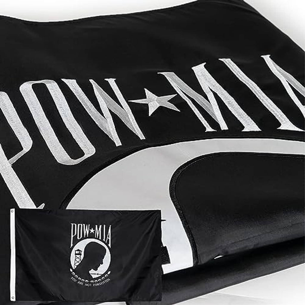 Outdoor POW/MIA flag corner view, black with white embroidered stripe lettering and star