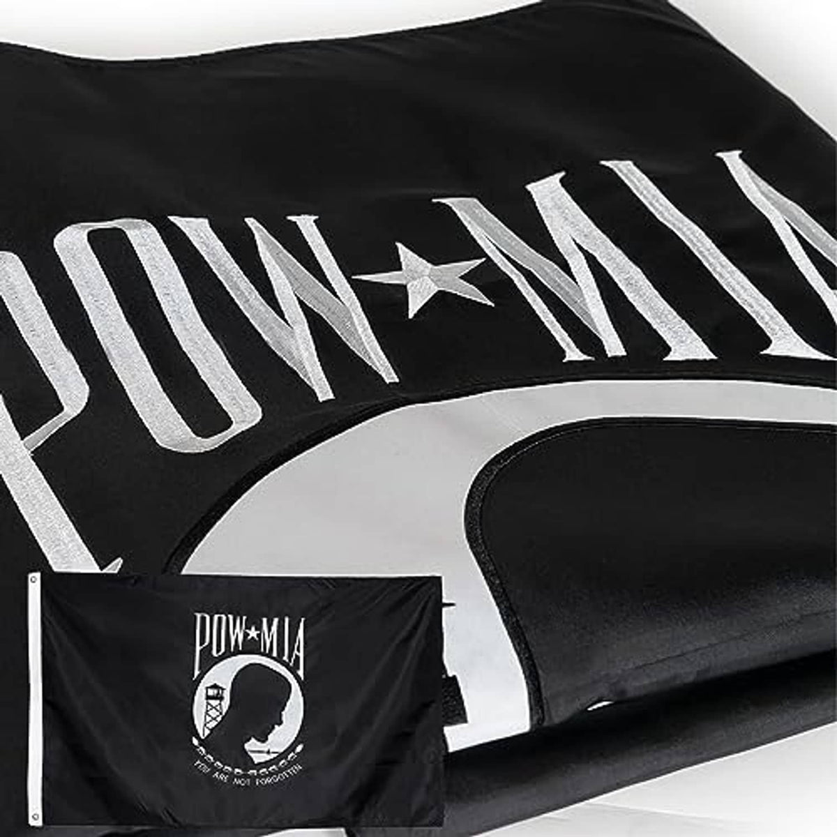 Outdoor POW/MIA flag corner view, black with white embroidered stripe lettering and star