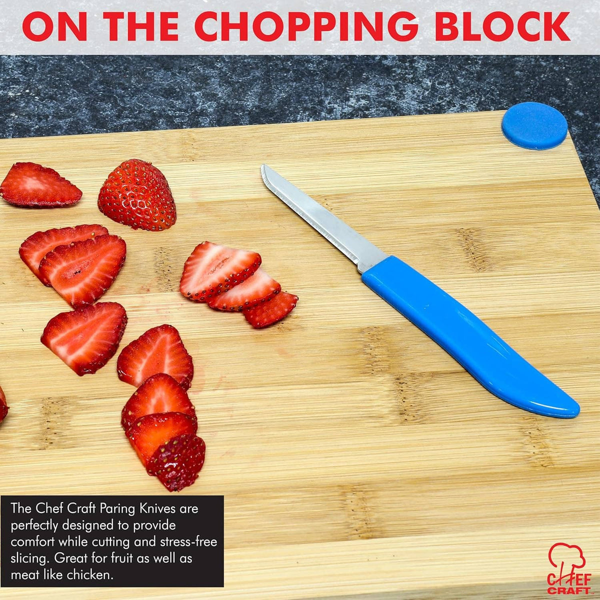 Paring knife on cutting board with sliced strawberries