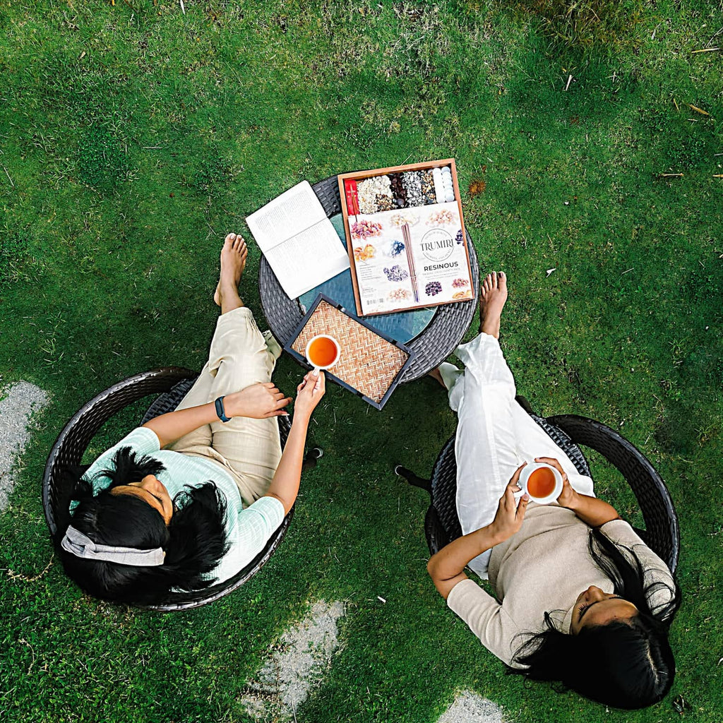 Trumiri resinous incense stick box held by two people outdoors