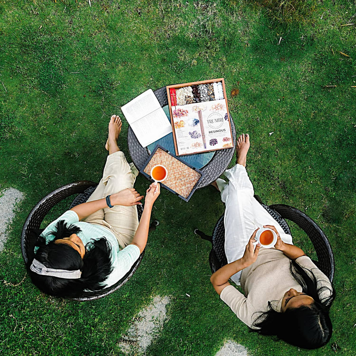 Trumiri resinous incense stick box held by two people outdoors