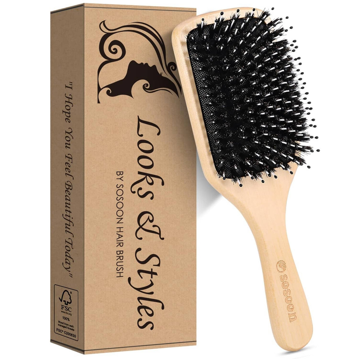 Wooden paddle hairbrush with black boar bristles beside product box