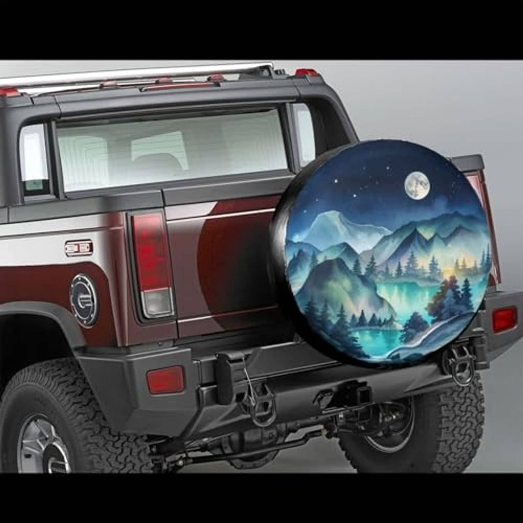 Spare tire cover on a rear SUV door cover, showing blue mountain night landscape