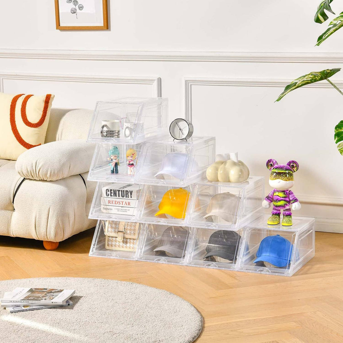 Stackable clear hat organizer storing multiple caps and accessories on tabletop
