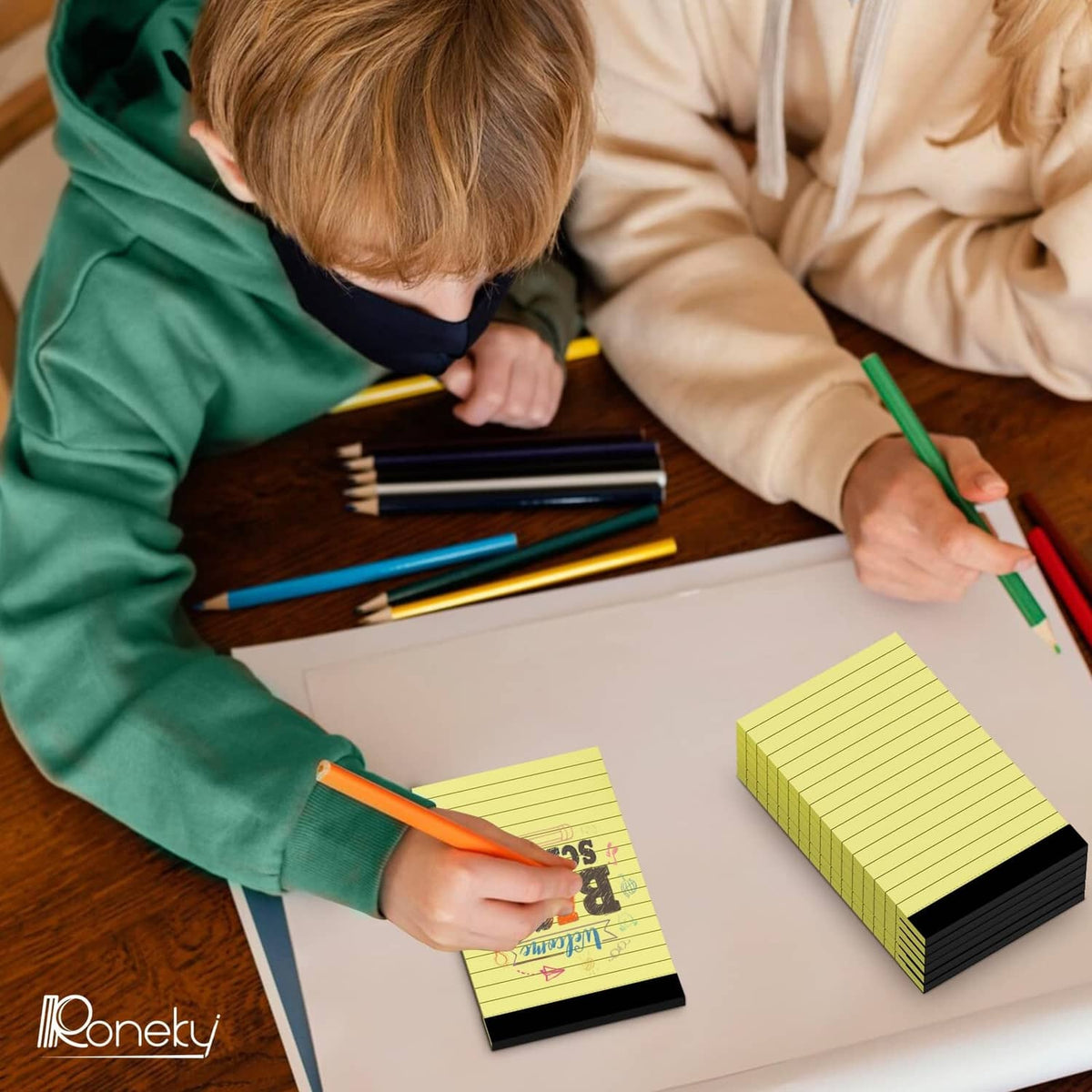 Yellow ruled notepad used for writing notes, compact 3x5 size