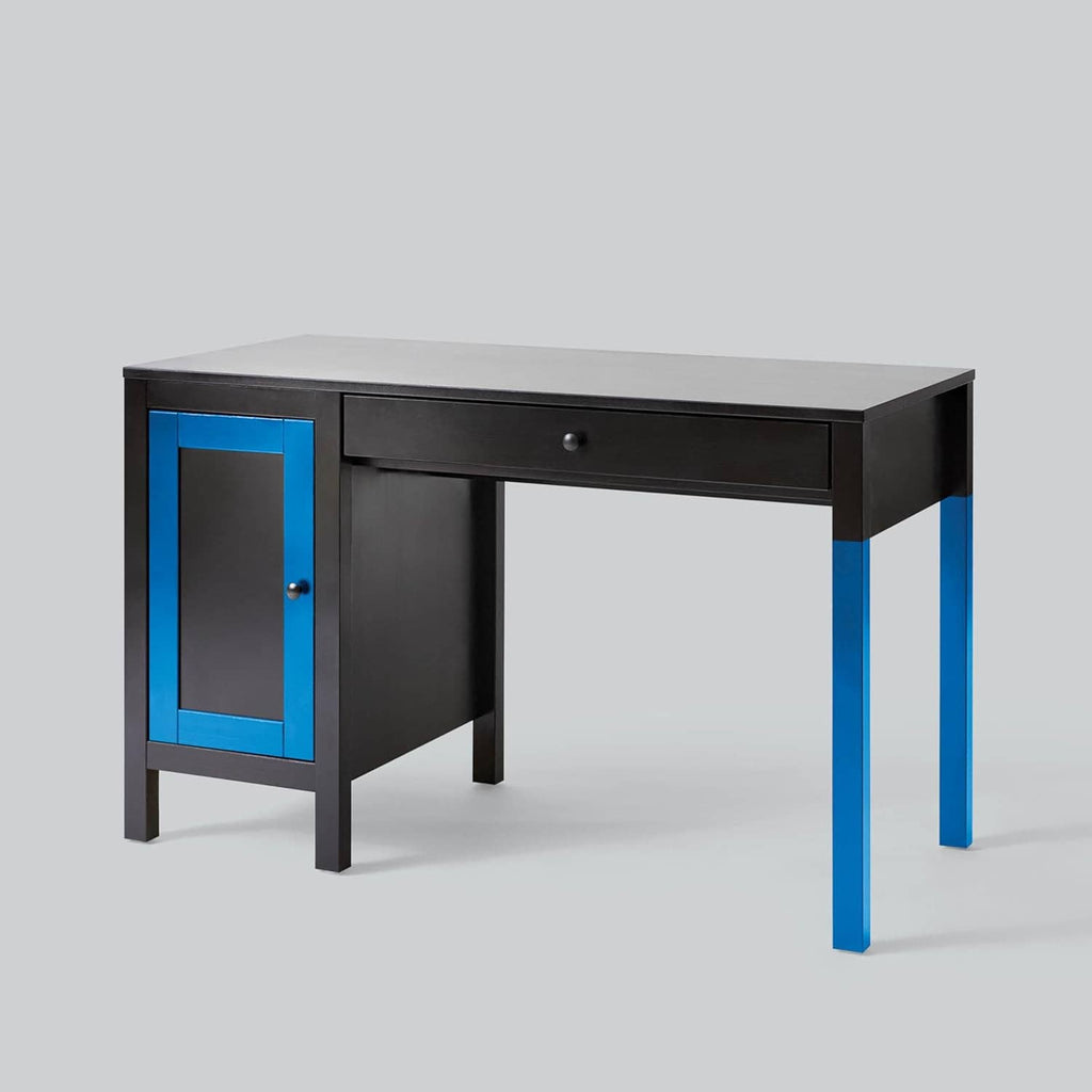 Paint coverage example: black desk with blue accents and a single drawer.