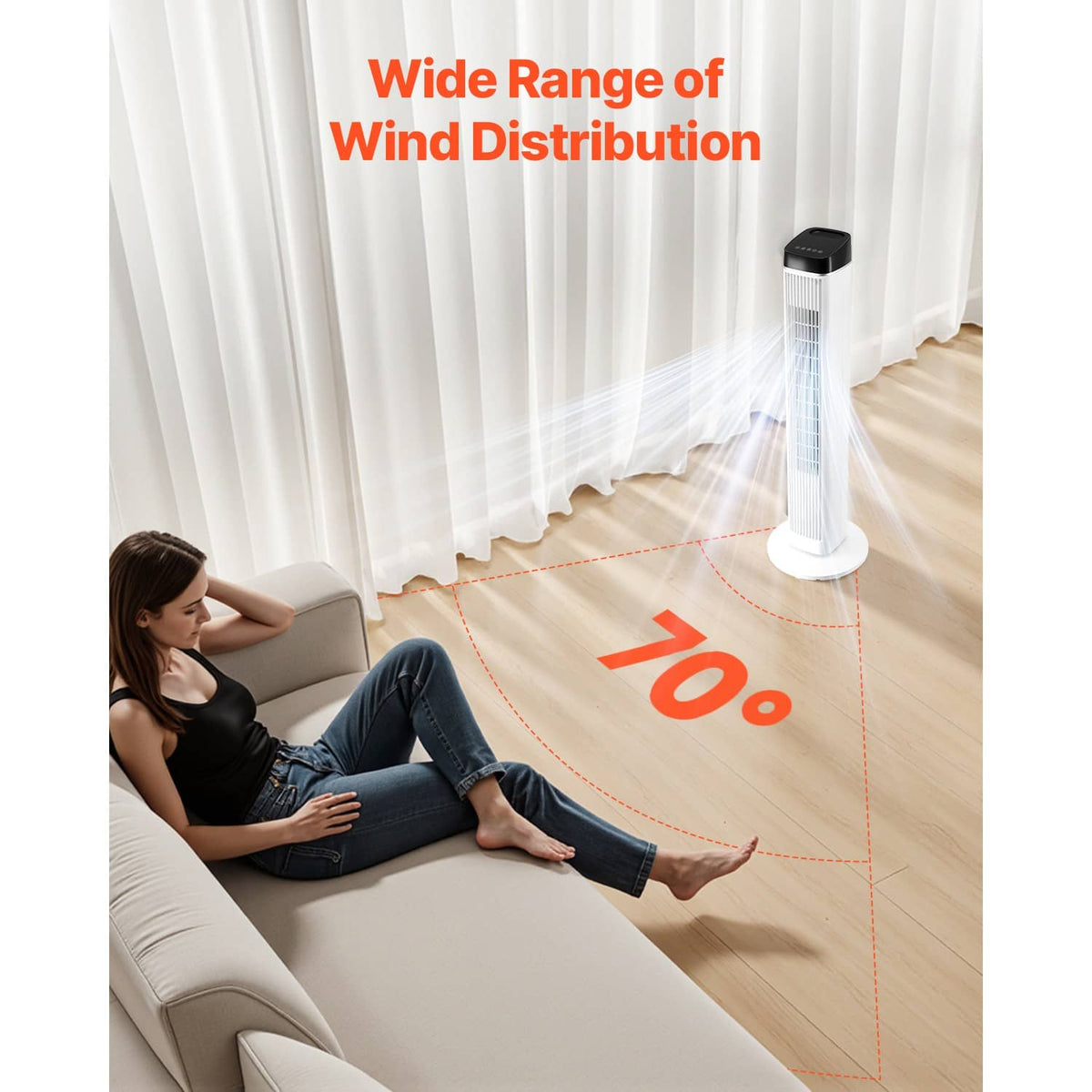 White tower fan projecting wide airflow across a room, with vertical air vents