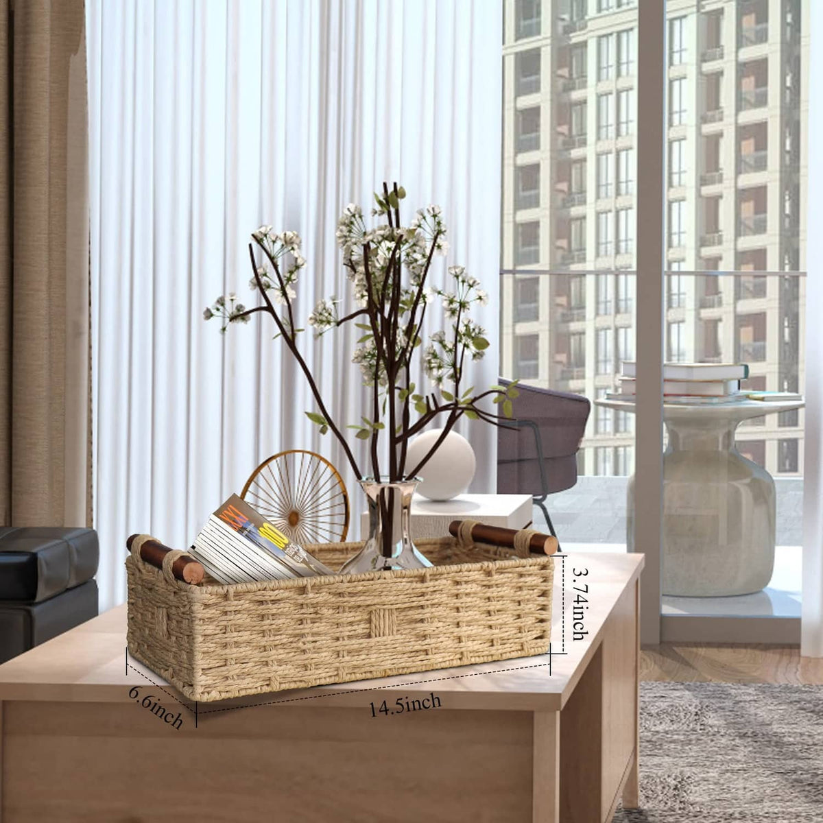 Beige woven paper rope storage basket with rope handles, open-top, front view.