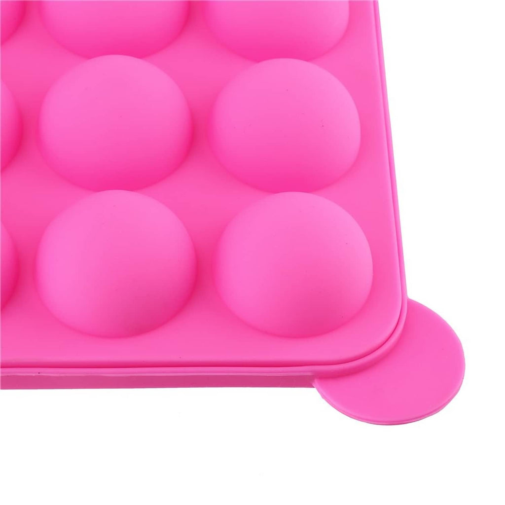 Close-up of pink silicone mold cavity bottoms for cake pops