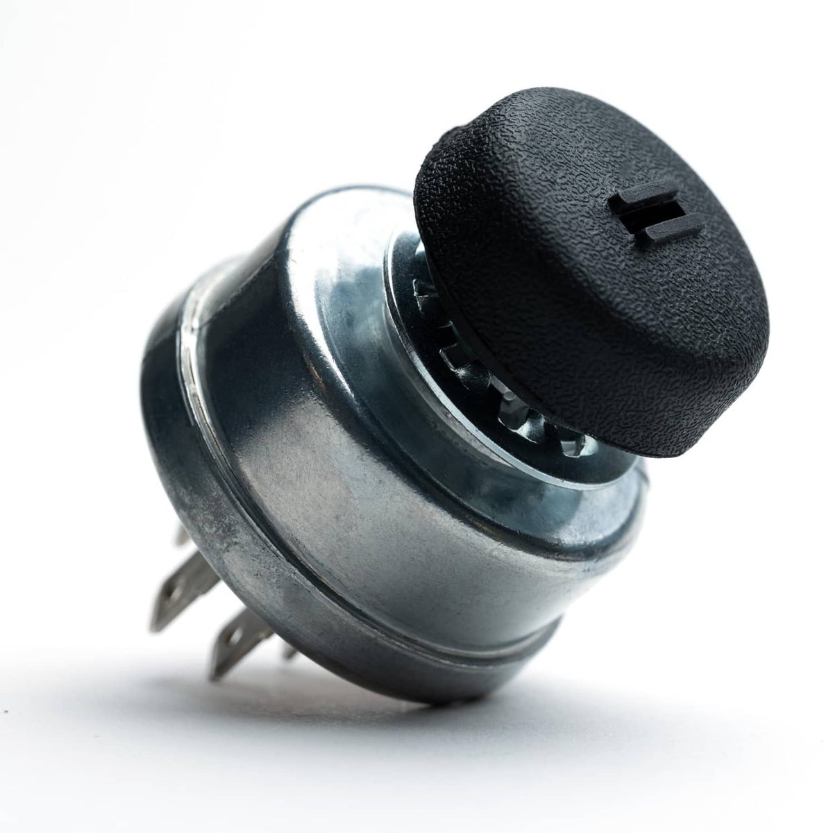 Ignition switch cylinder with black protective cap and key-socket opening