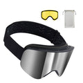 Silver mirrored ski goggles with black strap, included spare lens and cloth bag.