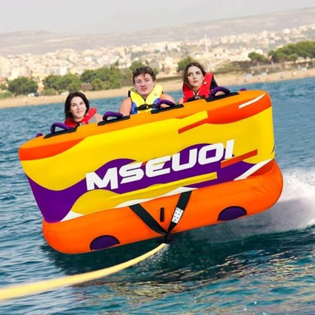 Orange inflatable towable tube for 1 rider on the water with purple and yellow graphics.