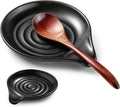 Black ceramic spoon rest with swirl rings and matching wooden spoon