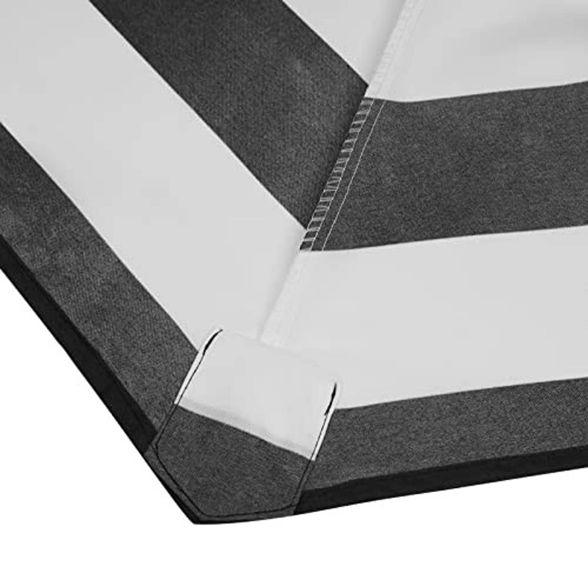 Black umbrella canopy fabric panel with stitched seam and foldover edge