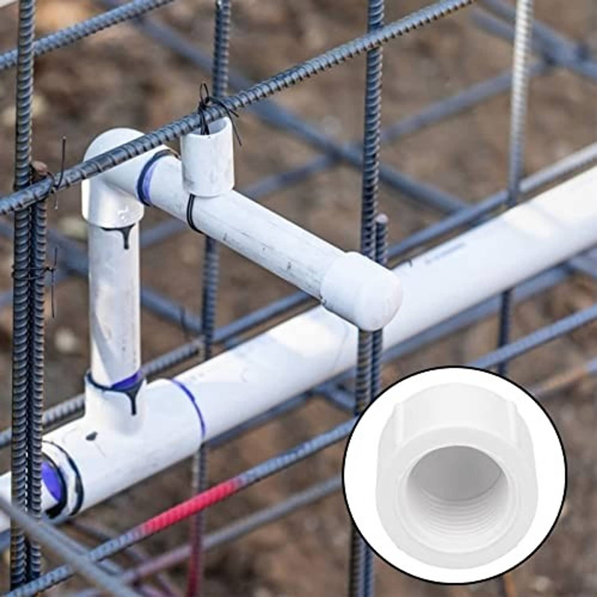 White PVC 1/2 inch female threaded pipe end cap fitted on a pipe