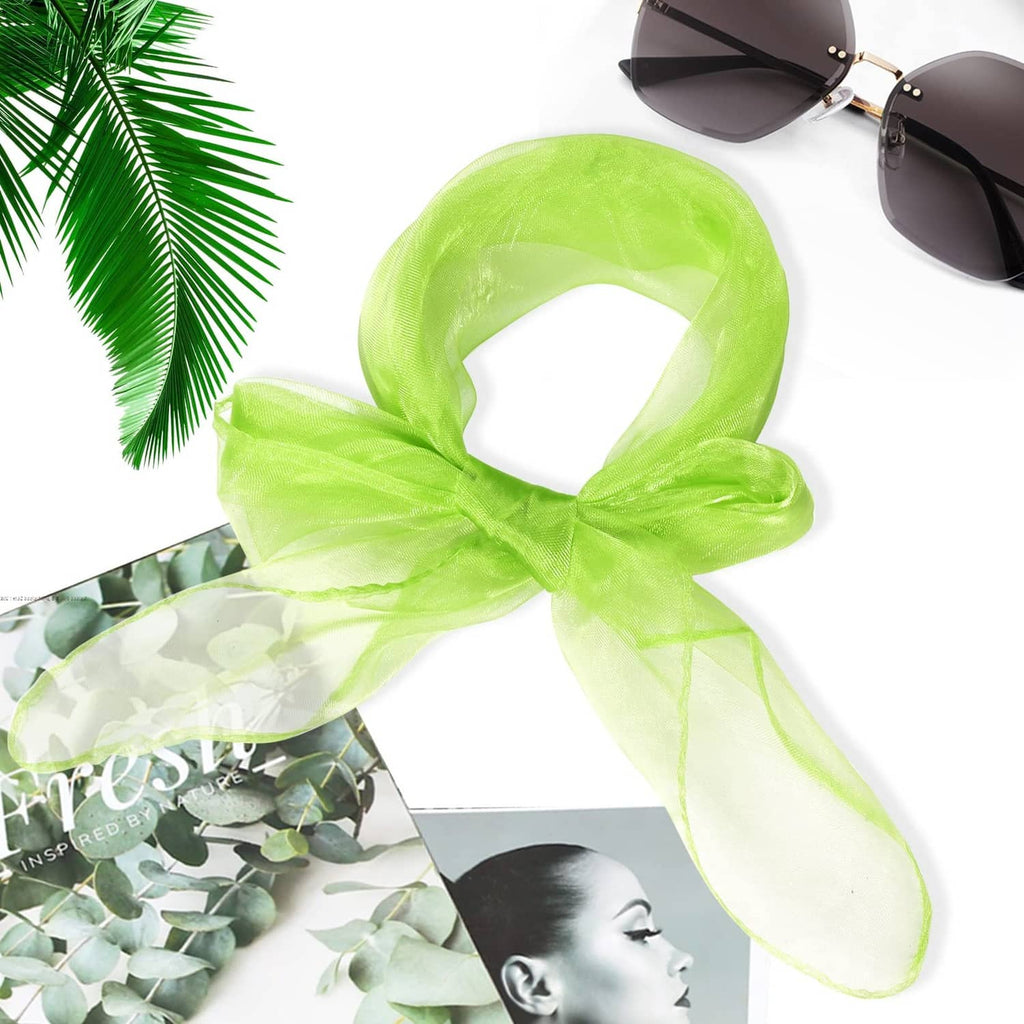 Neon green sheer silk dance scarf tied in a loose knot, flowing edges