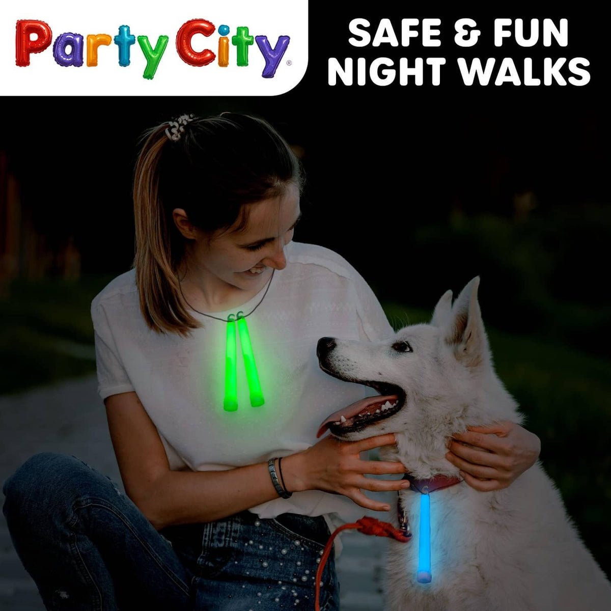Glow stick glowing in child’s hand while pet dog wears a string light