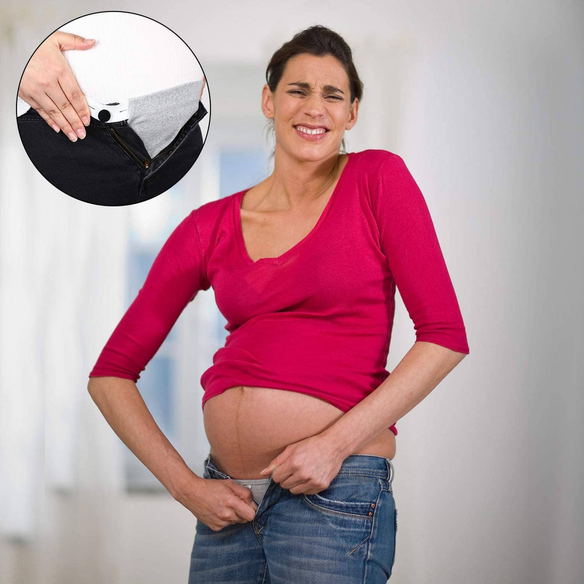 Maternity pants extender on jeans waistband, adjustable tab positioned at the front
