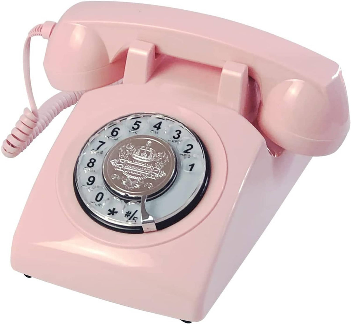 Pink rotary dial corded telephone close-up with numbered dial ring