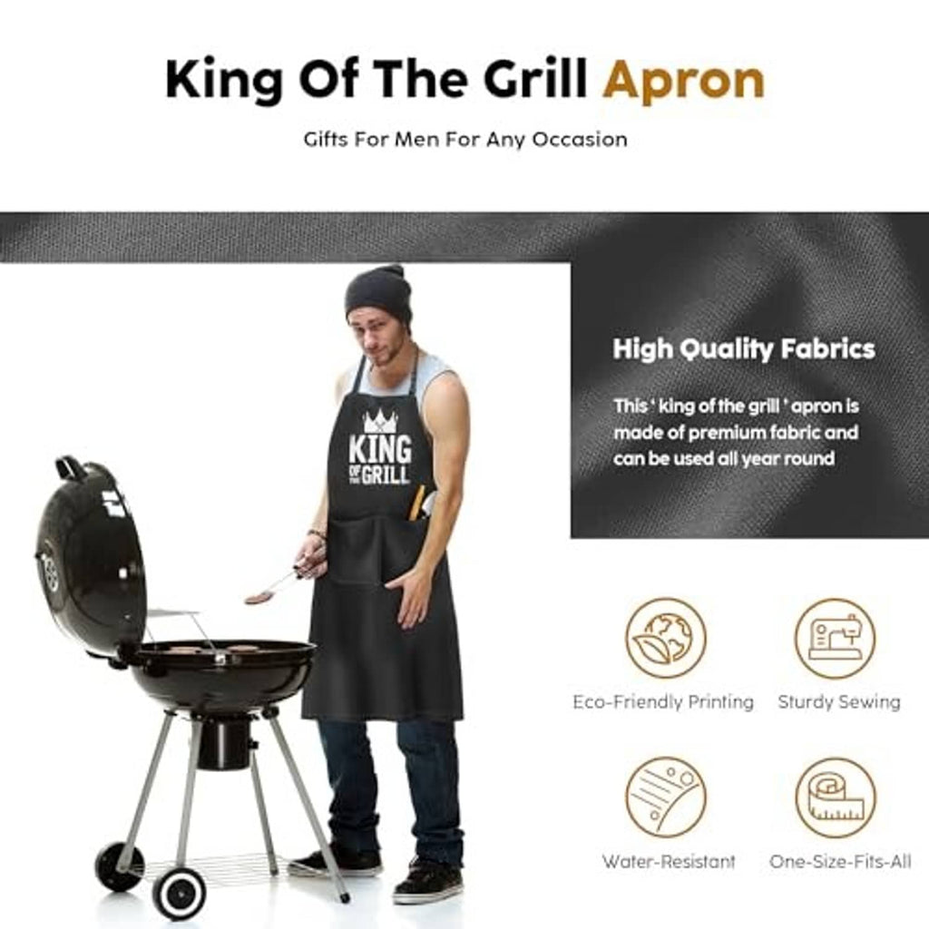 Black 'King of the Grill' apron worn by a cook, adjustable neck strap, front coverage