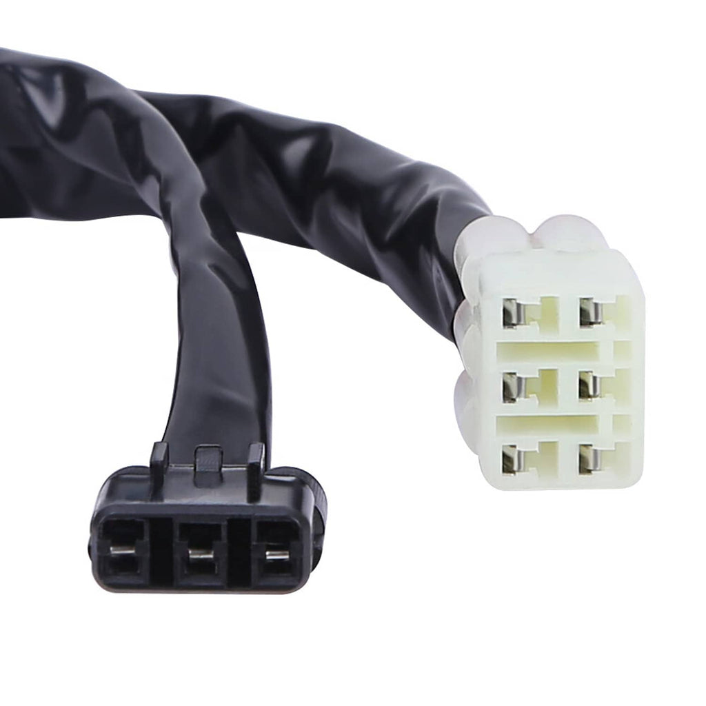 Close-up of white connector and black socket on bundled wiring harness