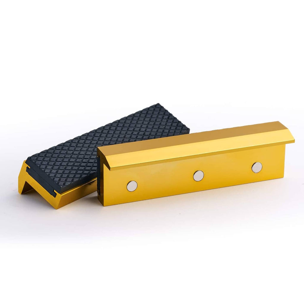 Golden soft vise jaw pad cover set with black textured gripping surface