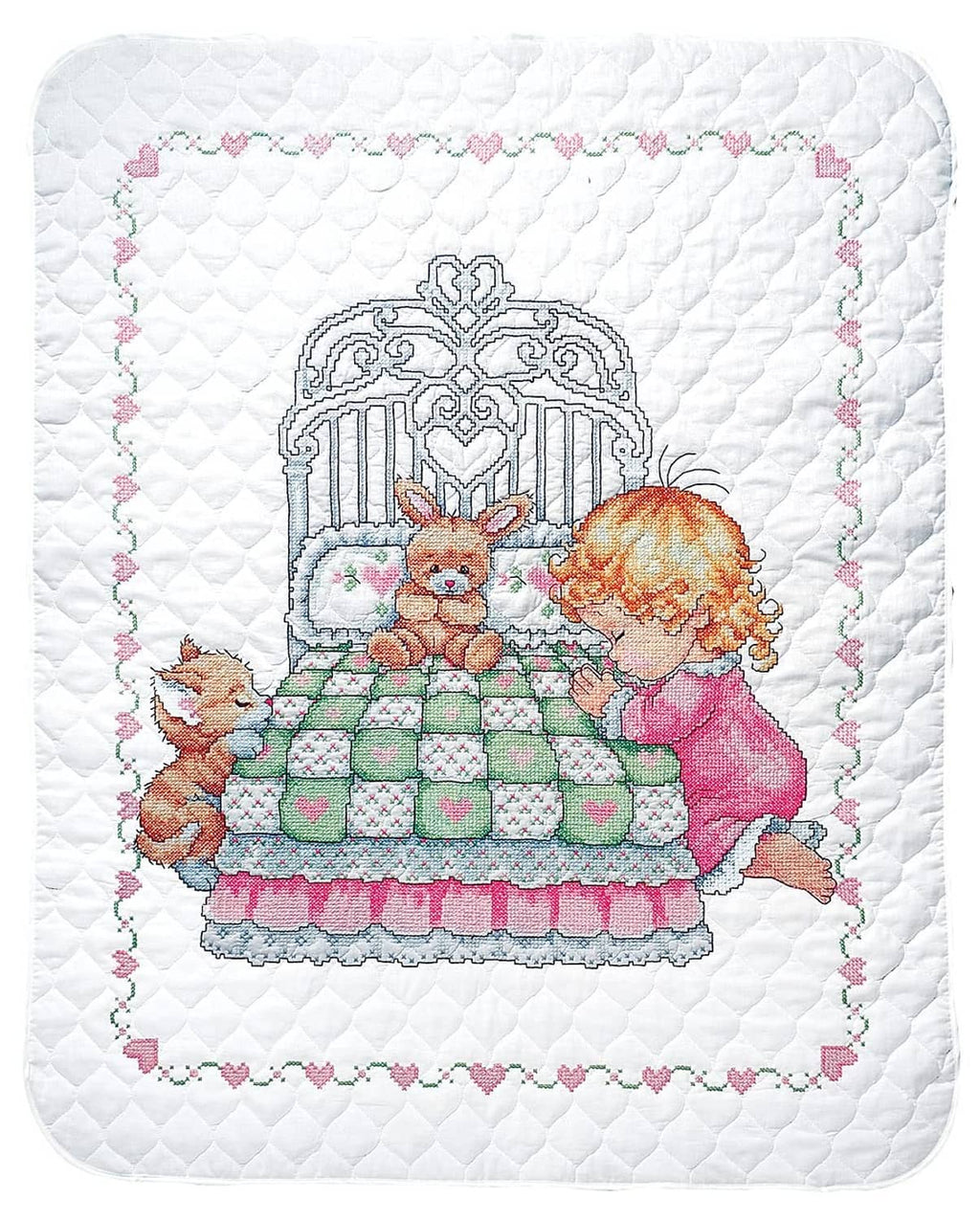 White baby quilt with multicolor stamped cross-stitch scene of a girl, bunny, and basket