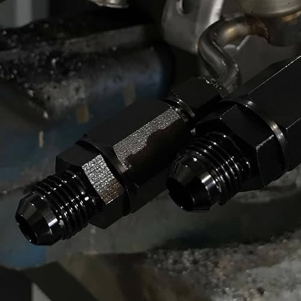 Close-up of black flare-to-1/2 in NPT adapter threads on hex body