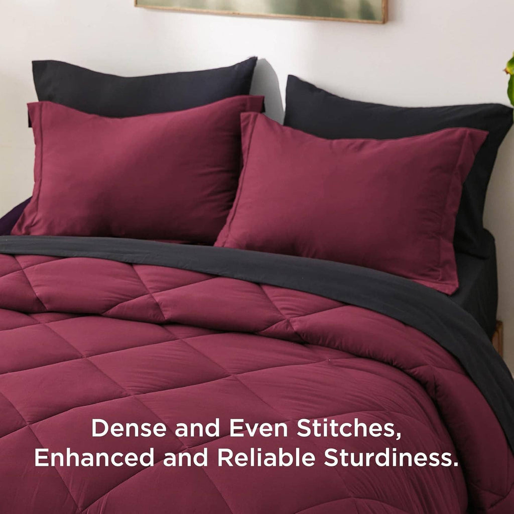 Bedsure queen comforter set showing burgundy quilted stitching with black reverse and pillows