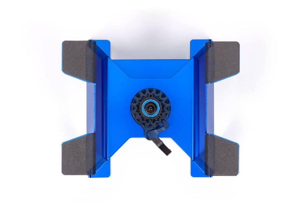 Blue TRAXXAS X-Truck stand rear view with circular wheel mount