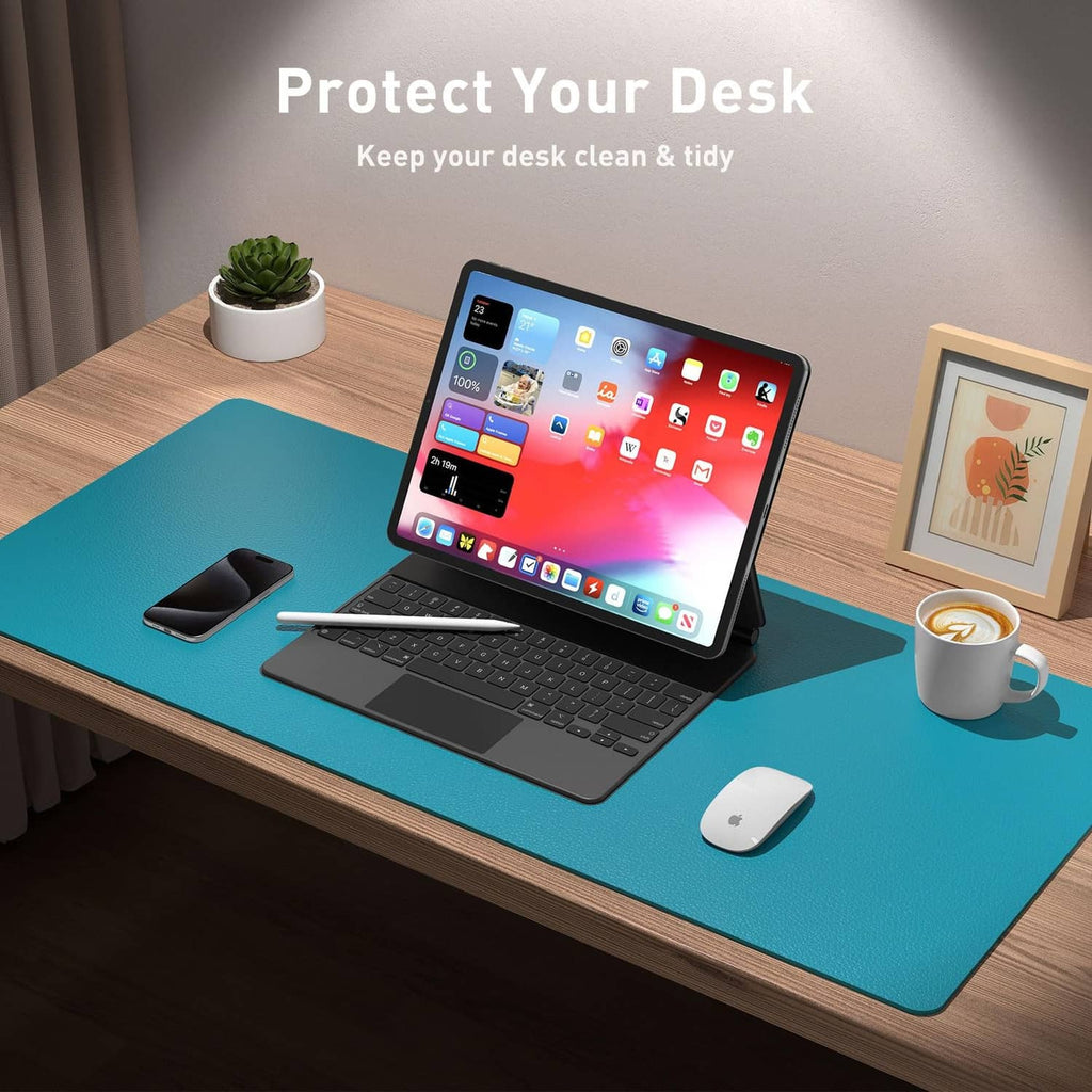 Turquoise desk pad protector on a desktop surface