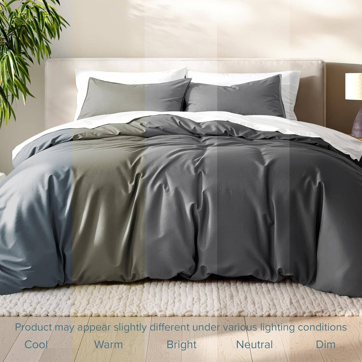 Dark gray duvet cover set with pillow shams on bed, smooth folded comforter.
