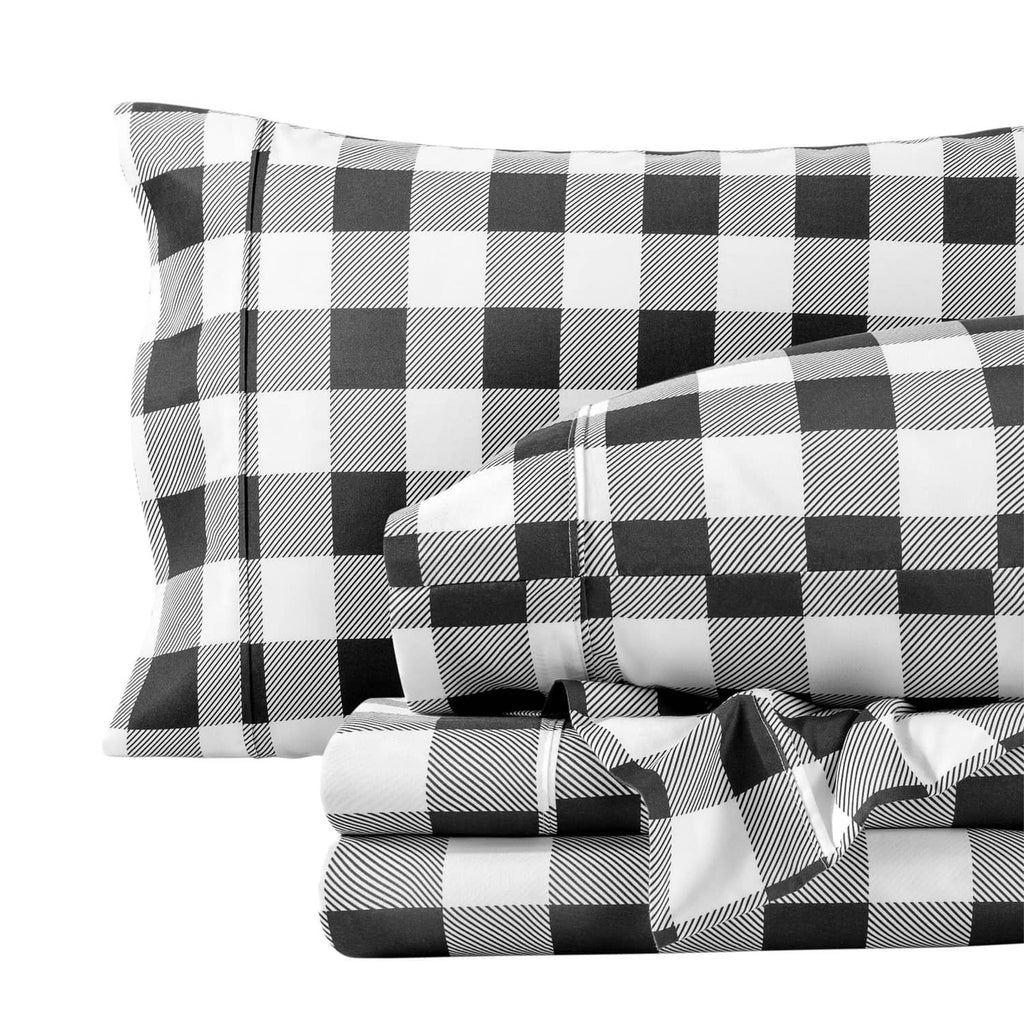Black-and-white buffalo plaid sheet and pillowcase set, neatly stacked