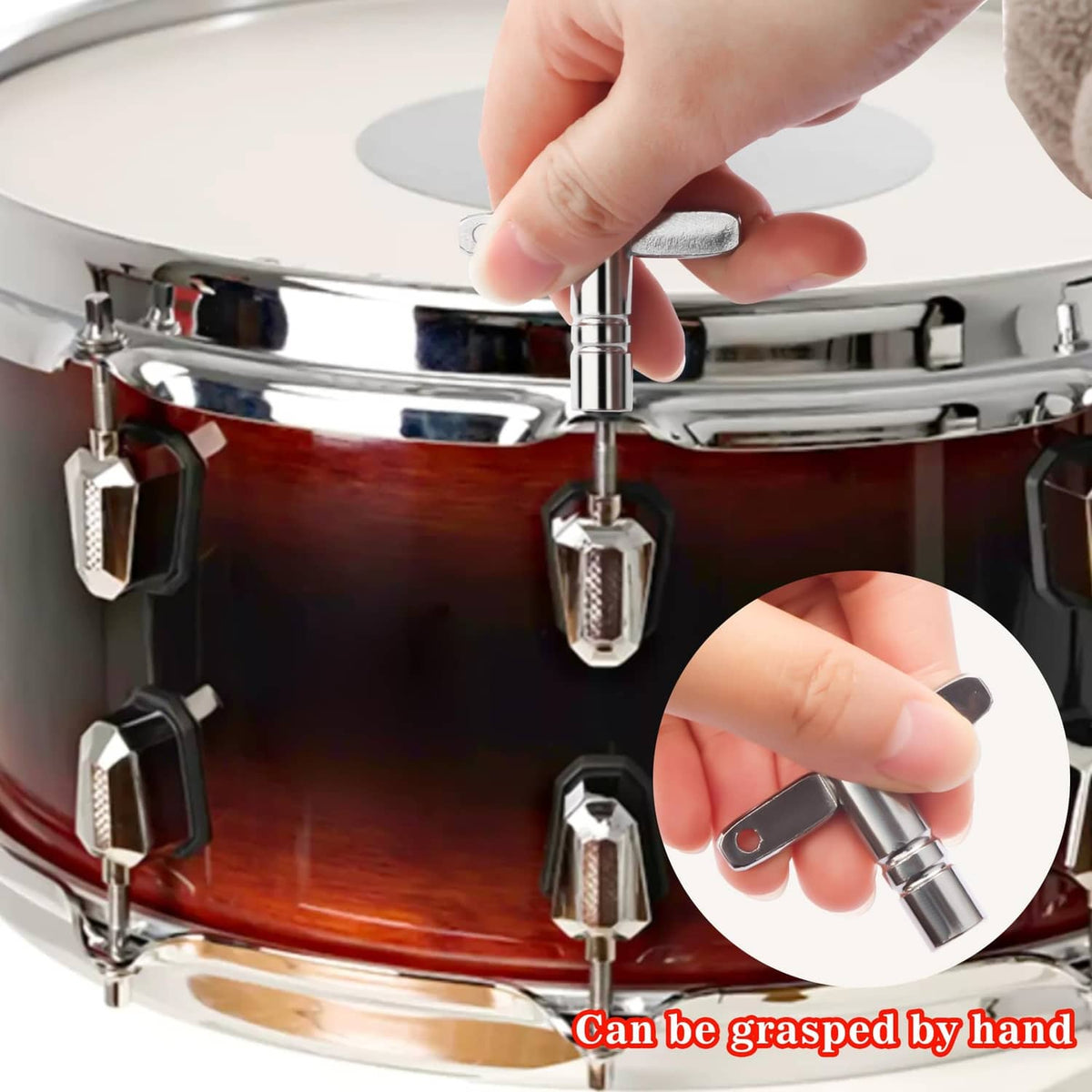 Chrome drum tuning key being turned on a metal drum tension rod
