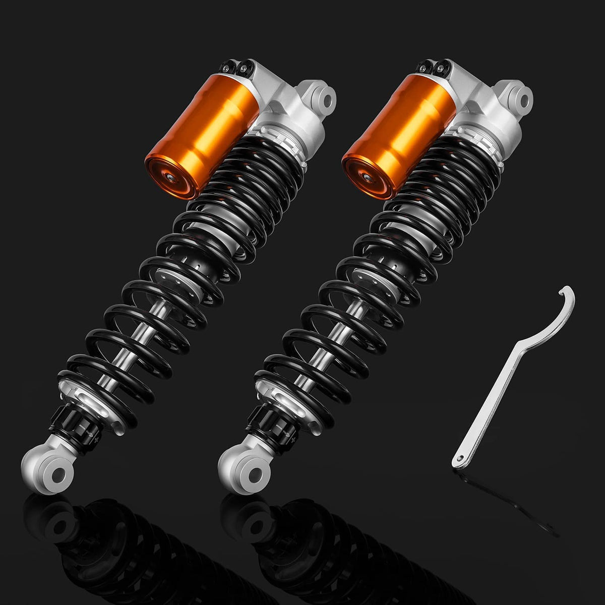 Front shock absorbers pair with orange reservoirs and black coil springs, adjustable wrench included
