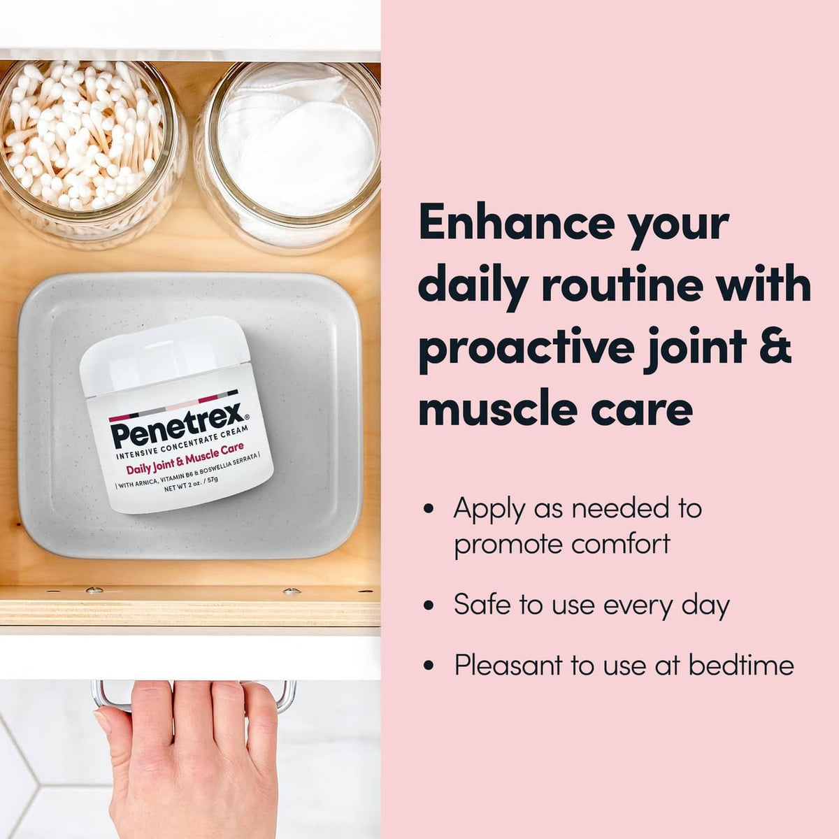 White cream jar with lid open and hand applying cream from the container