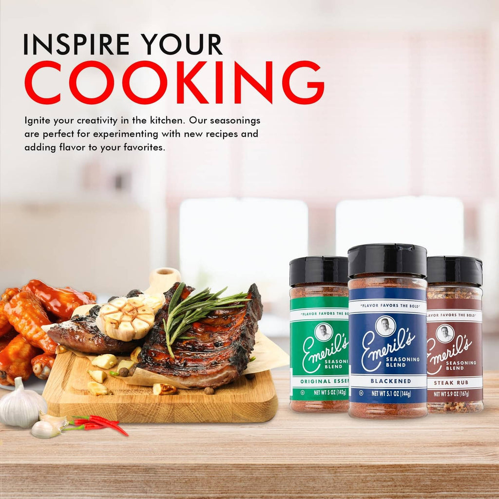Emeril's seasoning blend jars with cooked seafood and bread on a wooden board