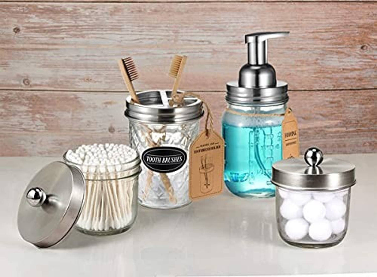 Foaming soap dispenser pump lids on mason jars with toothbrush holders, stainless steel