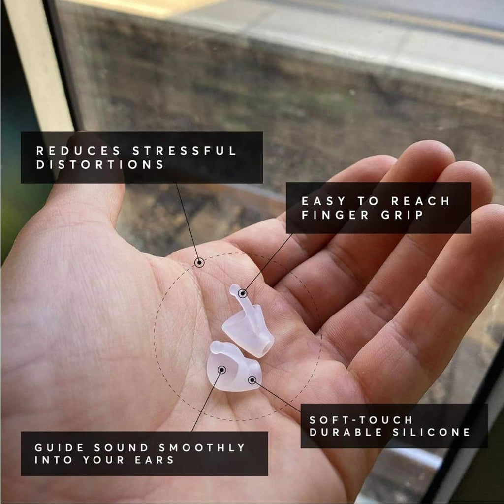 Hand holding small silicone earplugs, flexible curved tips