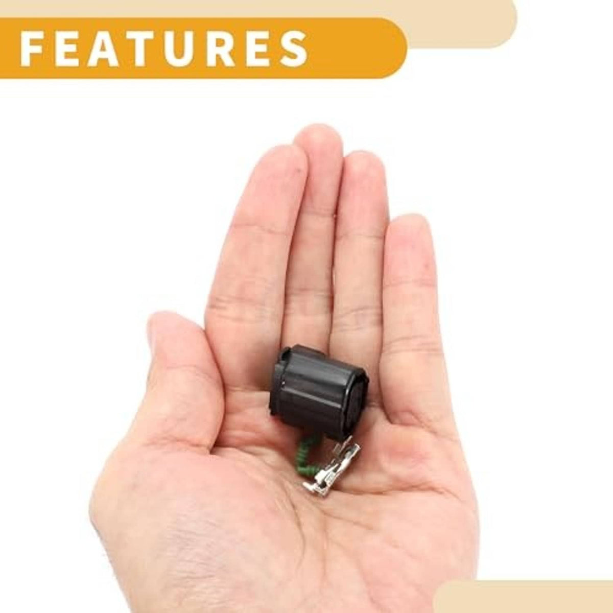 Small 3-pin camshaft sensor connector plug held in palm with metal terminals
