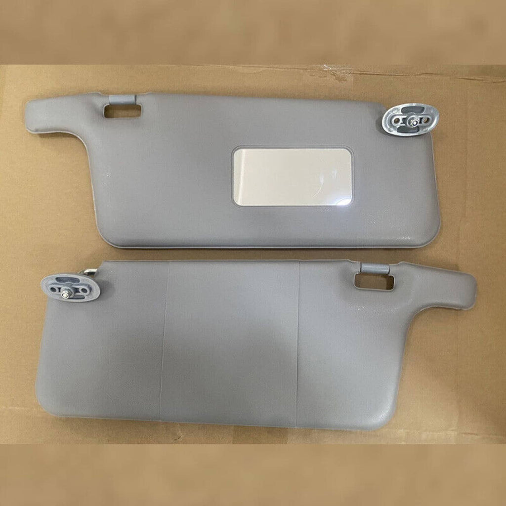 Gray sun visor pair with metal pivot mounts and mirror cutouts
