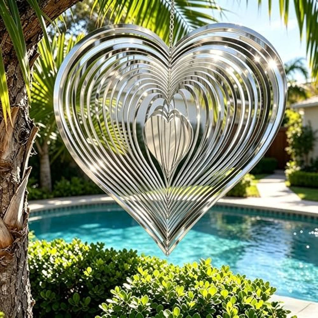 Reflective silver heart wind spinner with hanging chain and concentric reflective metal rings